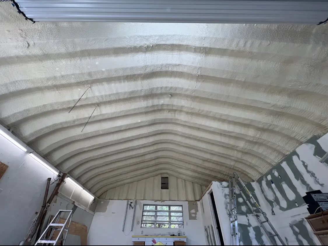 Spray polyurethane foam applied to the underside of a metal roof deck in Indian Harbour Beach